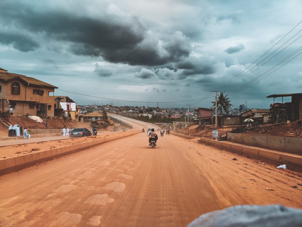 TMVC client riding a motorcycle in Africa